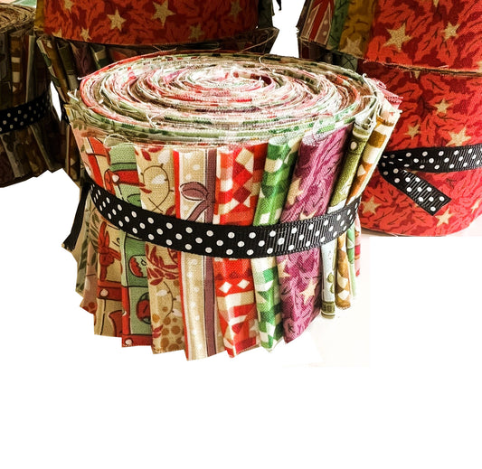 A roll of fabric cut into small pieces, tied with a black and white polka dot ribbon, shown against a white background with other fabric rolls partially visible behind it.